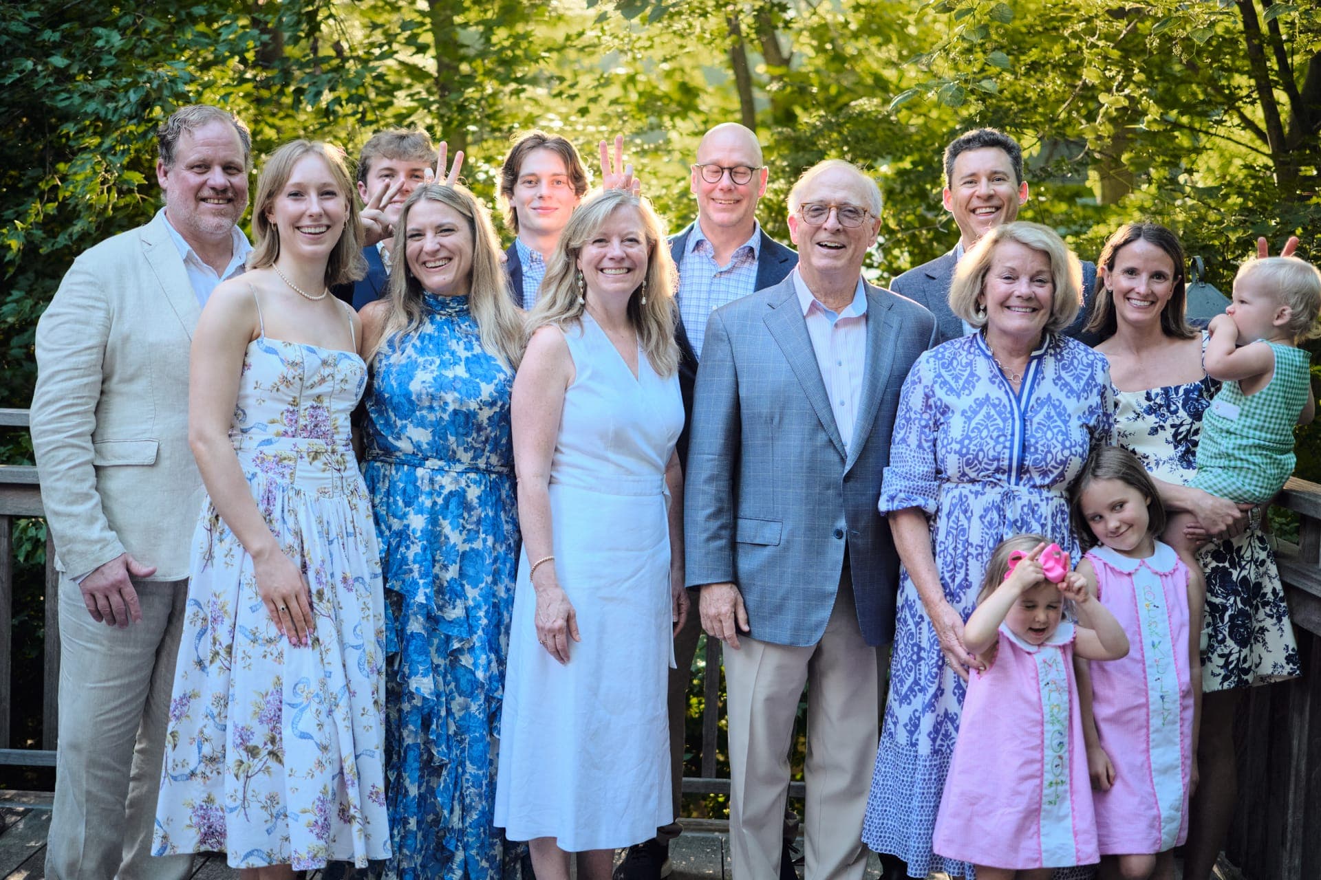 A family bursts into laughter during a group portrait at Deer Creek Club in Ladue
