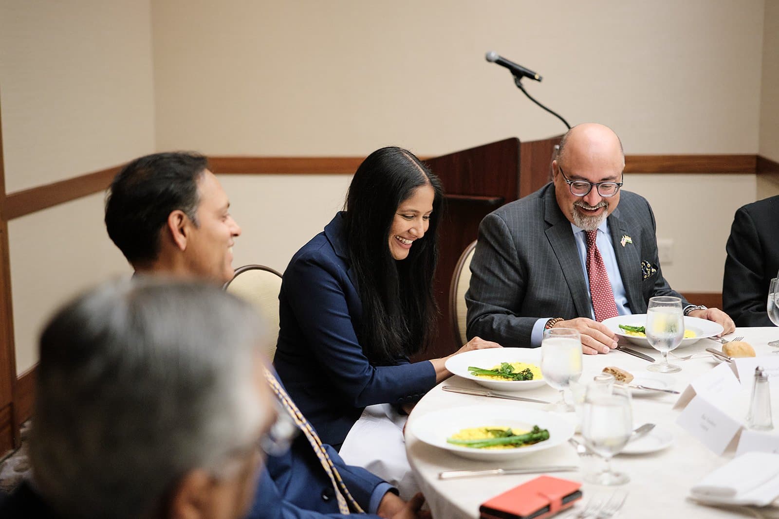 Guests seated at a lunch table during a US India Business Council conference session in St. Louis