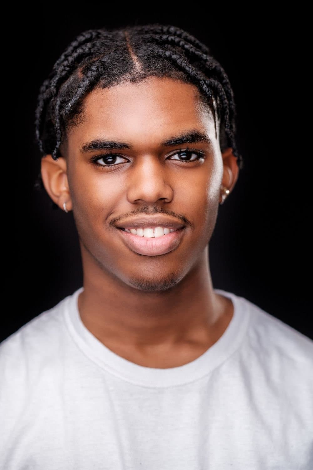 Dramatic theatrical acting headshot with moody lighting by Henry David Photography