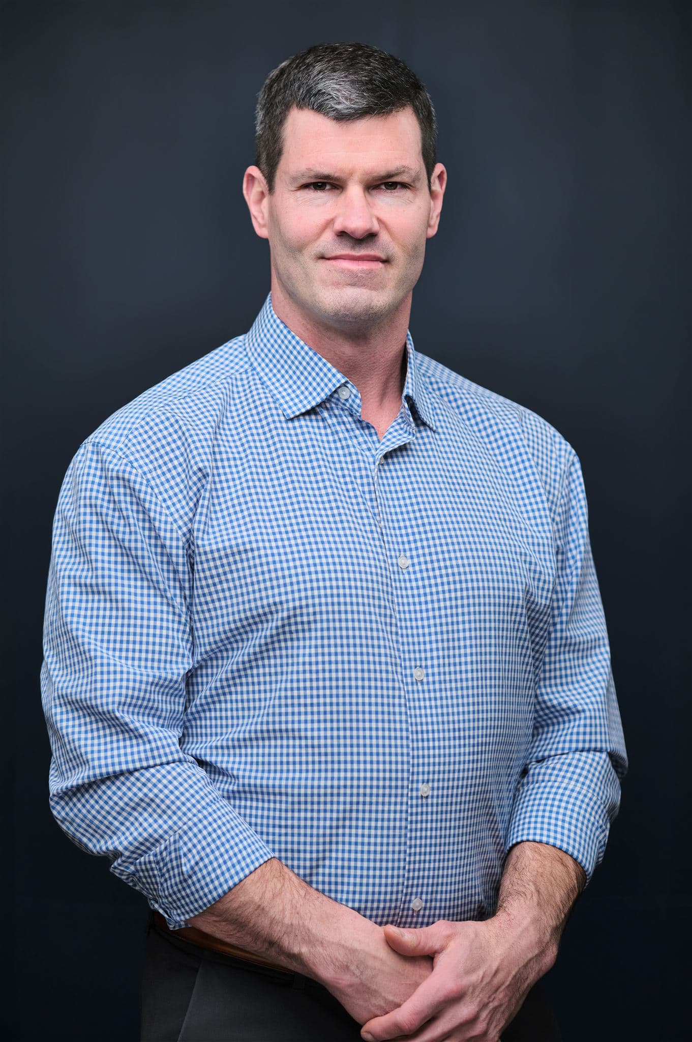 Confident professional portrait with creative studio lighting for interview video subjects in St. Louis