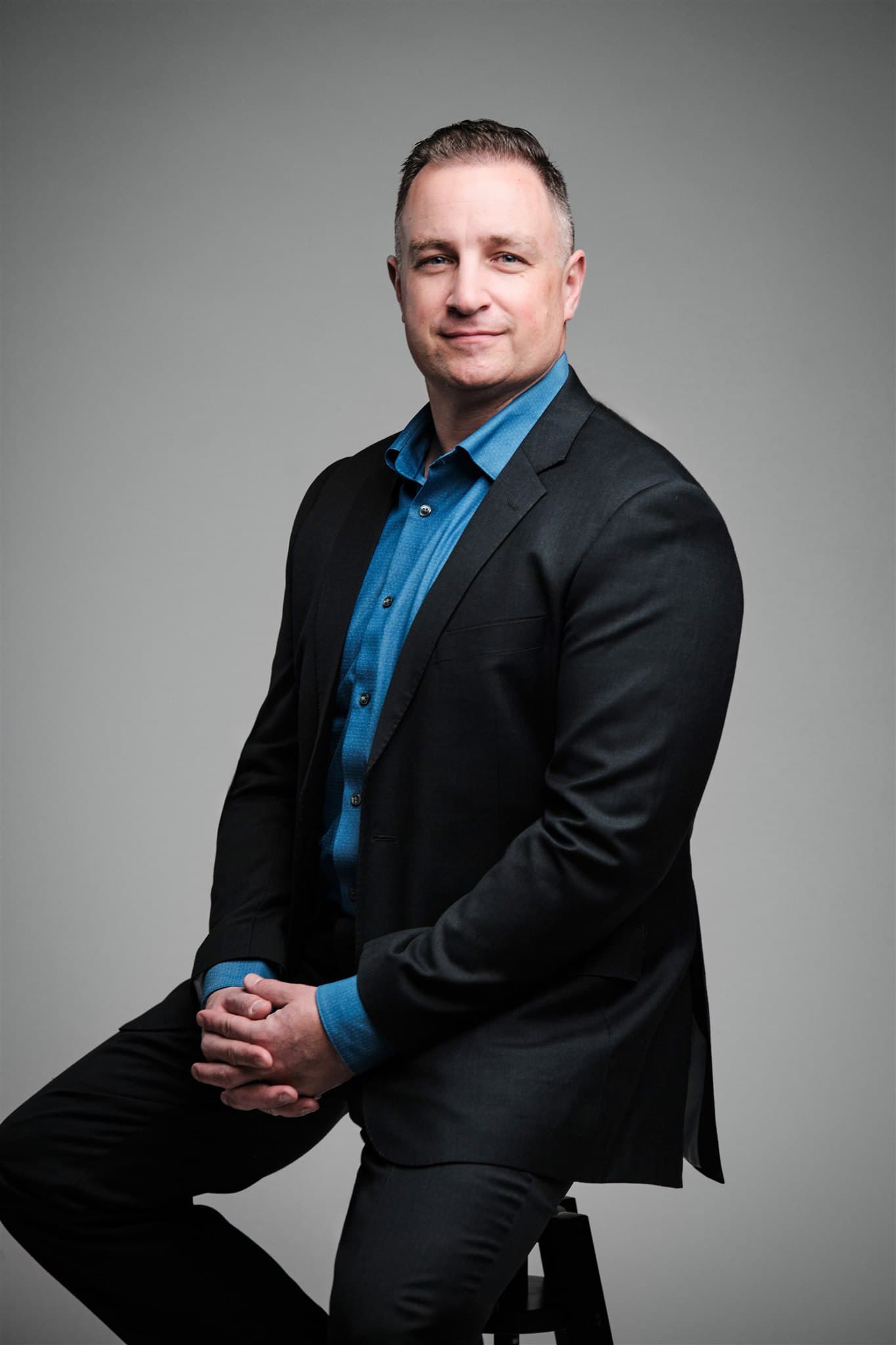 Corporate headshot with professional studio lighting by Henry David Photography