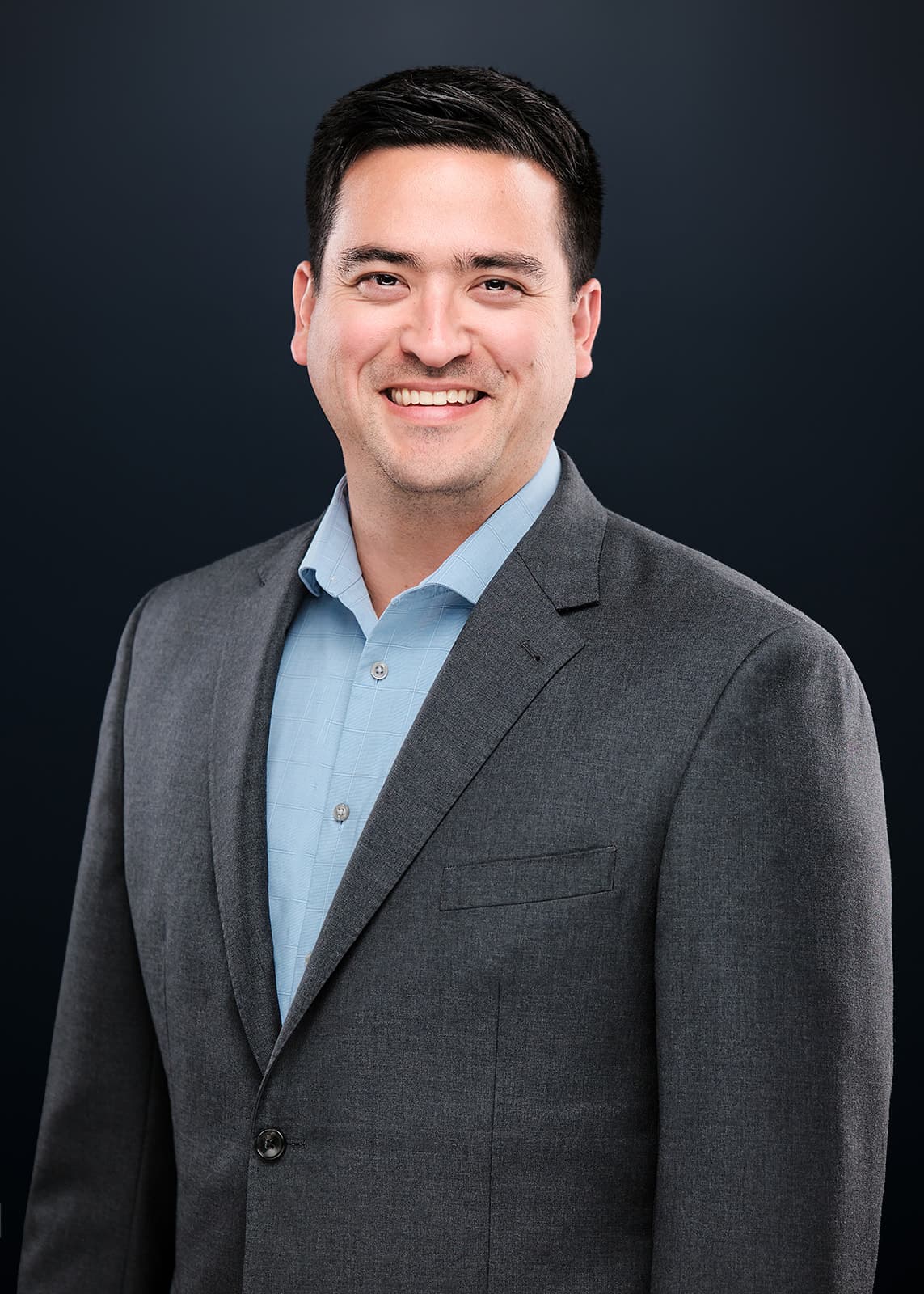 Professional headshot on a navy studio backdrop, St. Louis, by Henry David Photography