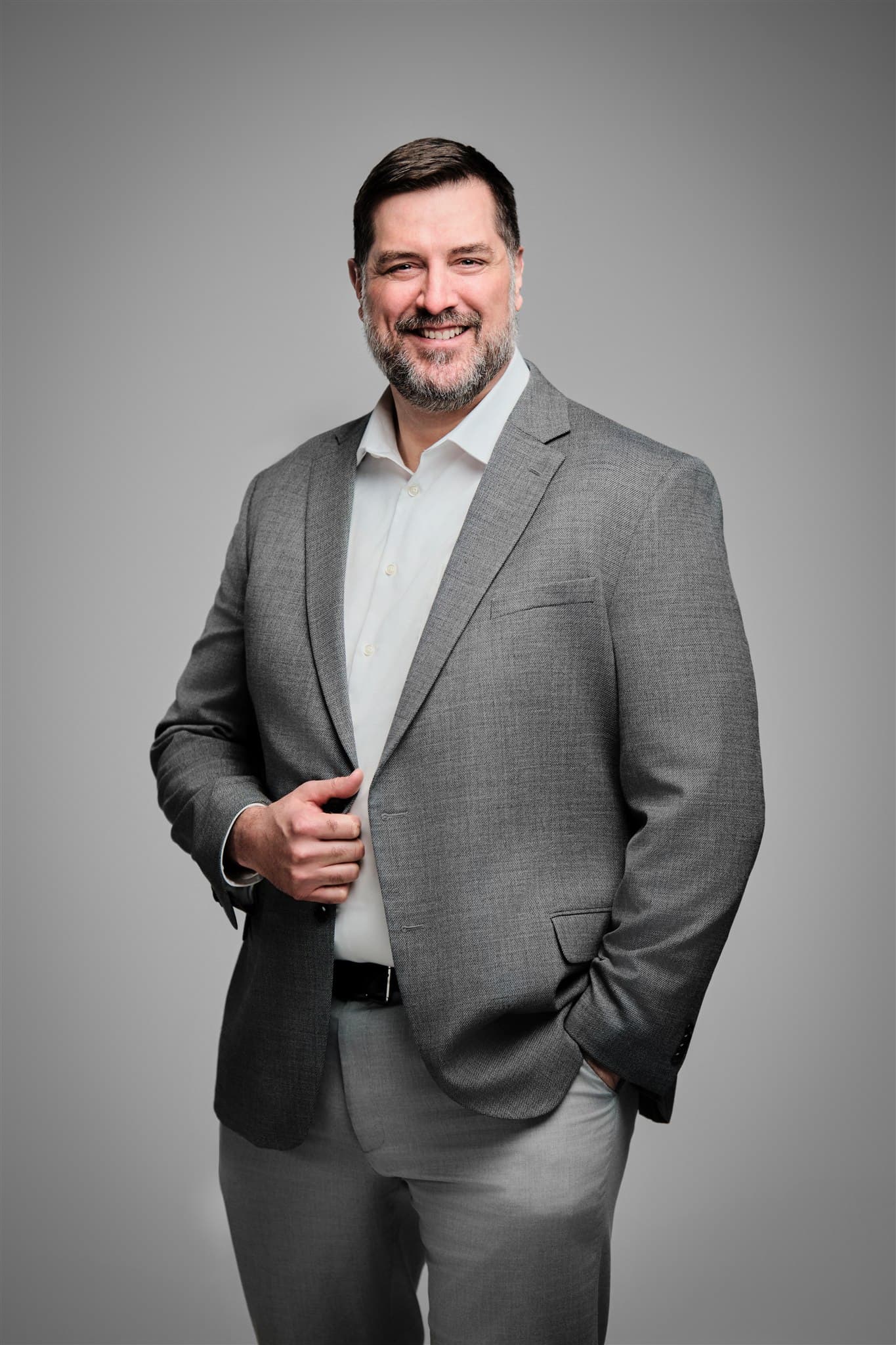 Corporate portrait on a studio backdrop, the standard a session at Schaumburg Corporate Center would be held to