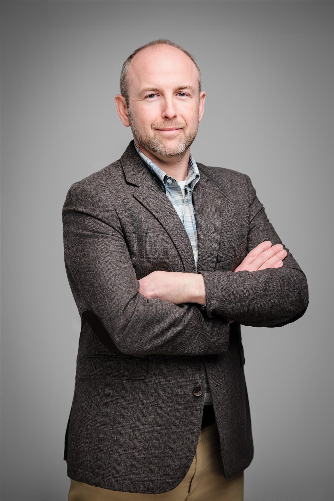 Corporate portrait on a studio backdrop, the standard a session at The Old Post Office would be held to