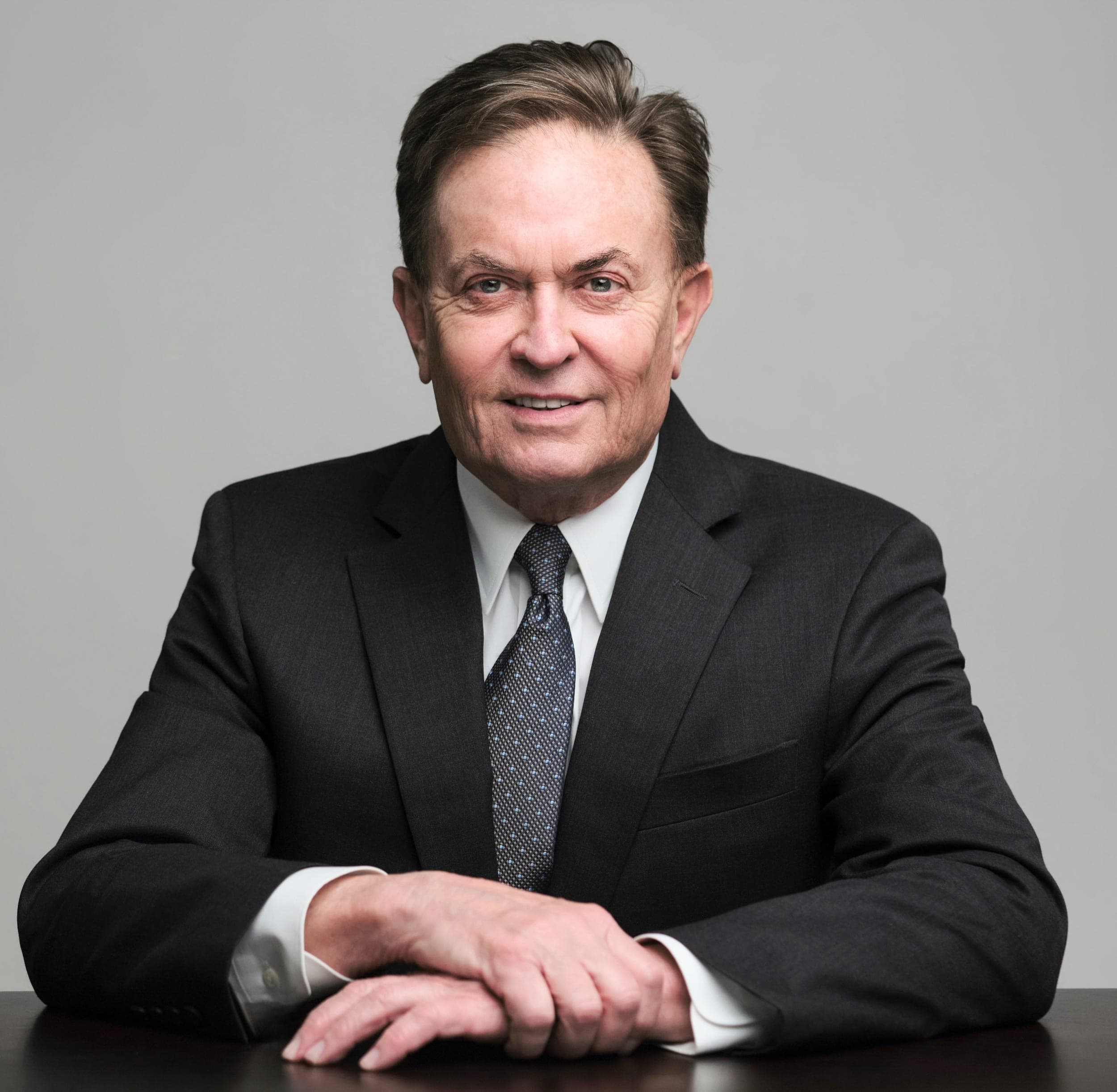 Seated executive portrait with negative space suited to a website about page, by Henry David Photography in St. Louis