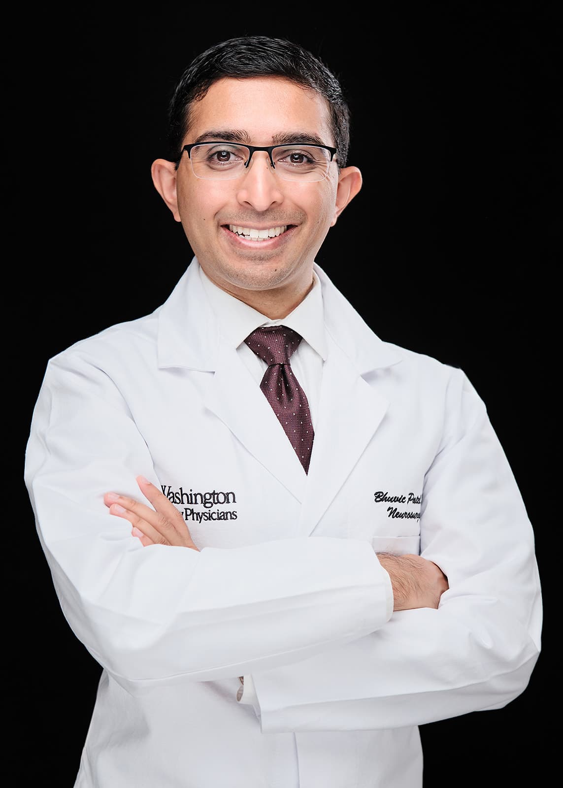Dr. Bhuvic Patel, Neurosurgery . White coat headshot at Washington University School of Medicine by Henry David Photography
