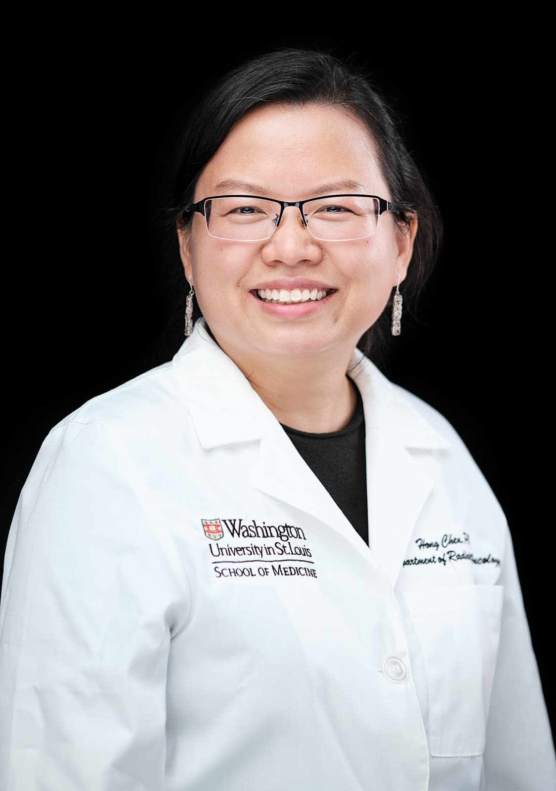Dr. Hong Chen, WashU Radiology, white coat headshot on black backdrop by Henry David Photography