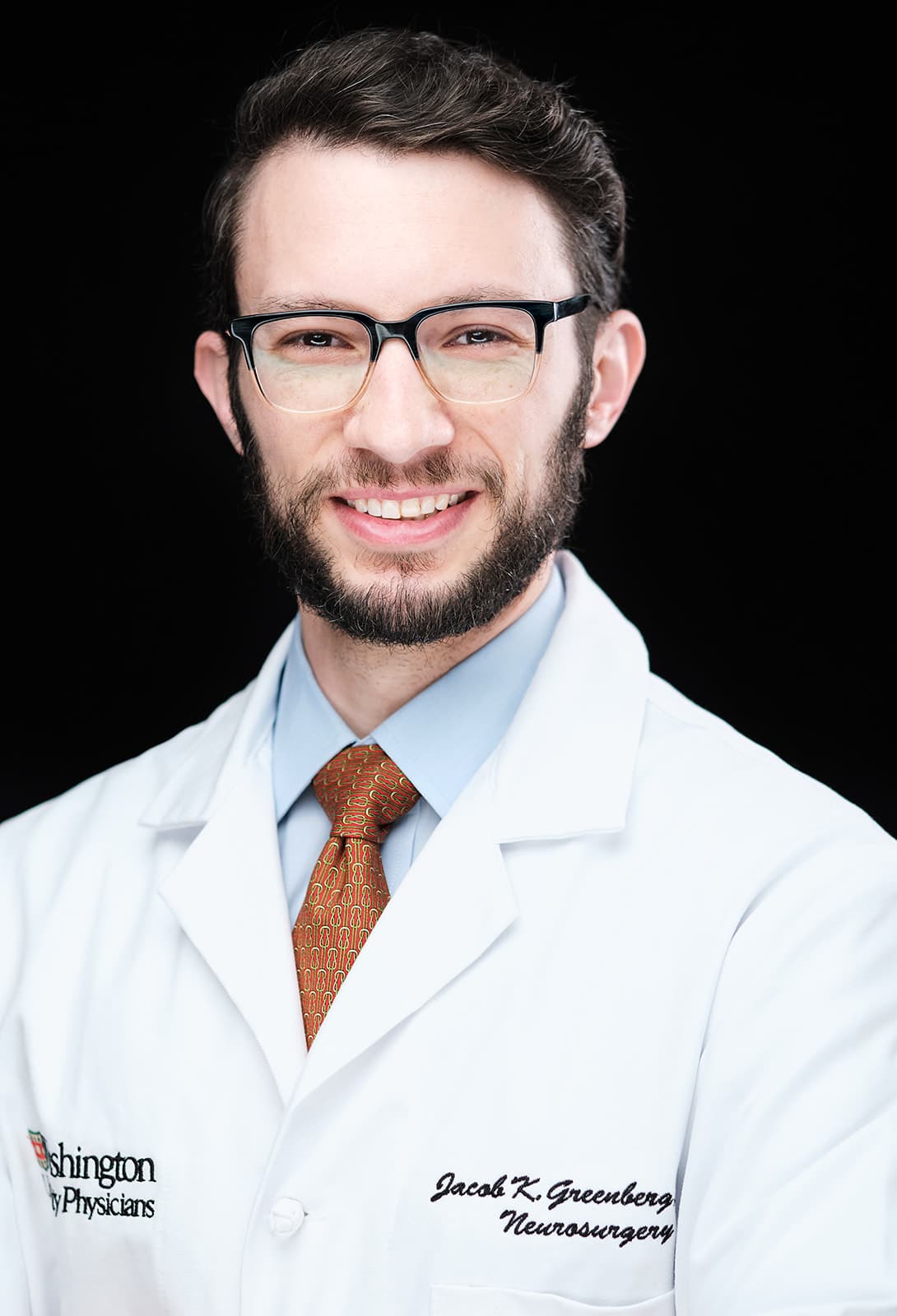 Dr. Jacob Greenberg, MD, MSCI, Neurosurgery . White coat headshot at Washington University School of Medicine by Henry David Photography