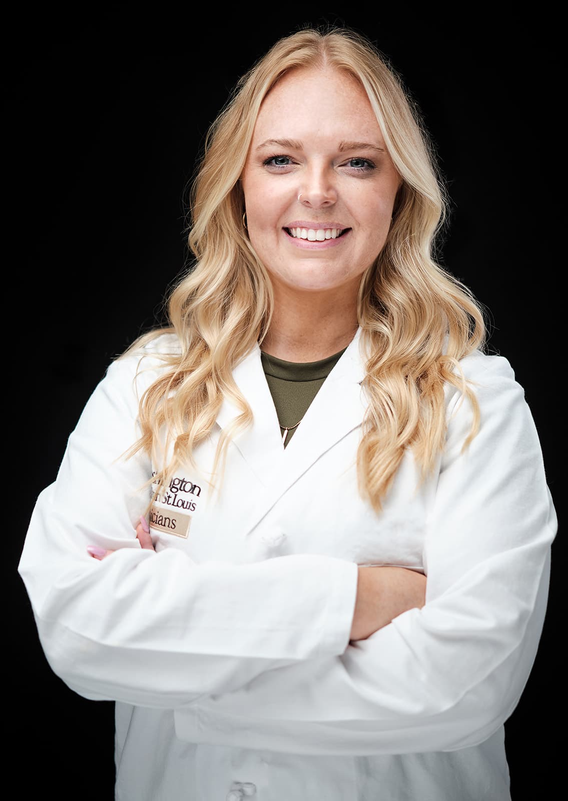 Kayla Jarrett PA, WashU Neurosurgery, white coat headshot on black backdrop by Henry David Photography