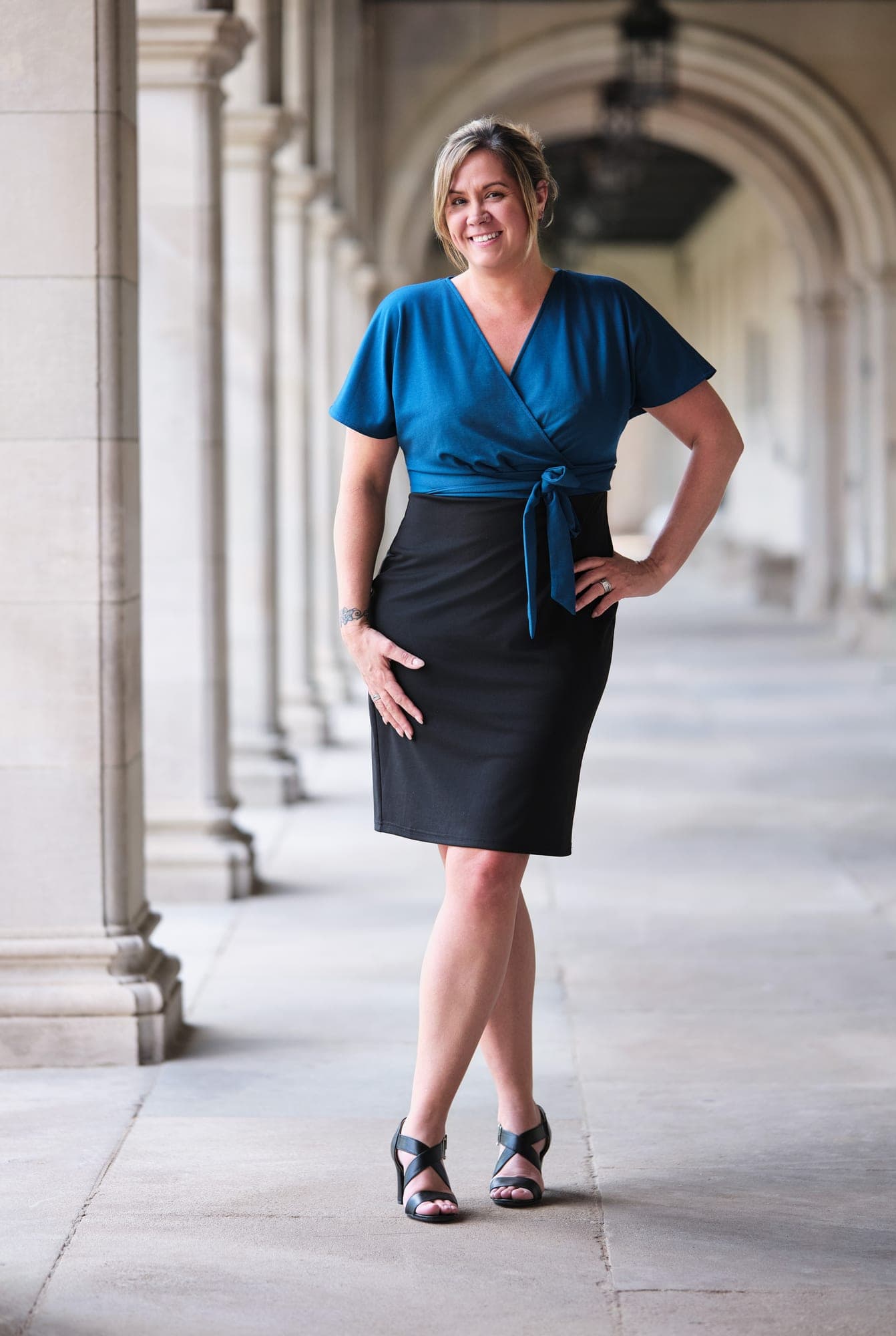 Staff headshot with controlled lighting and a consistent background for a multi-location workforce program