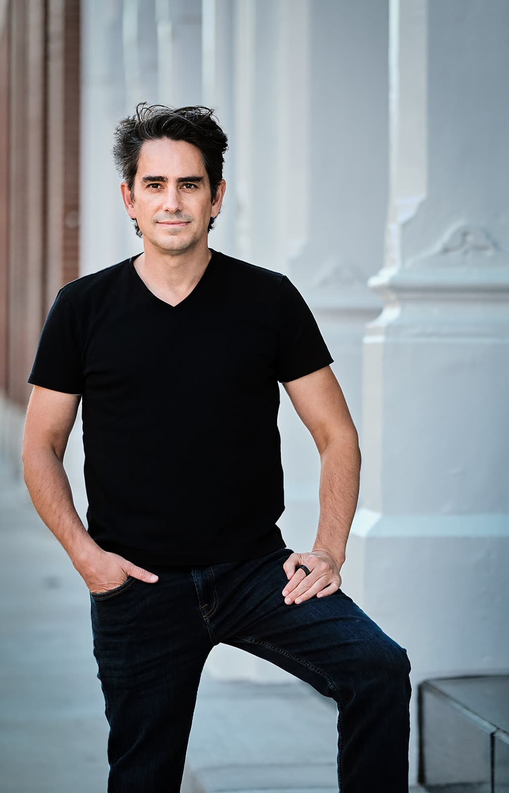 Walker Deibel casual personal branding portrait with urban architecture