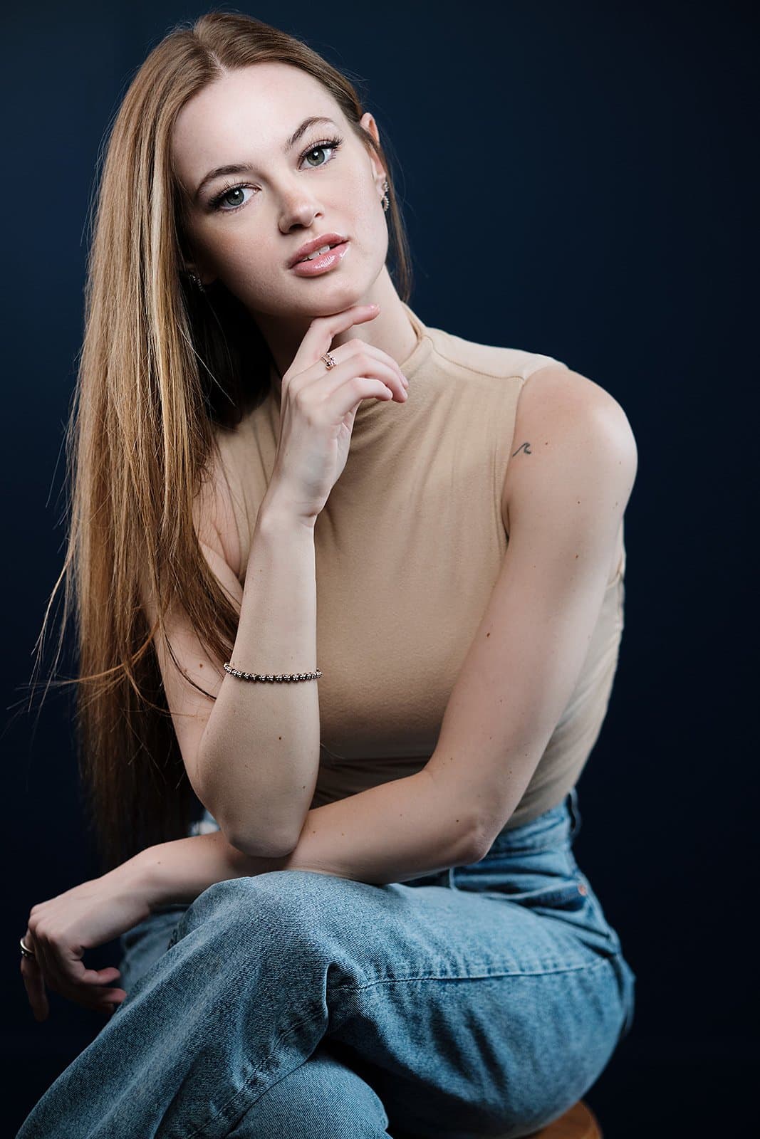 Studio senior portrait with professional lighting by Henry David Photography
