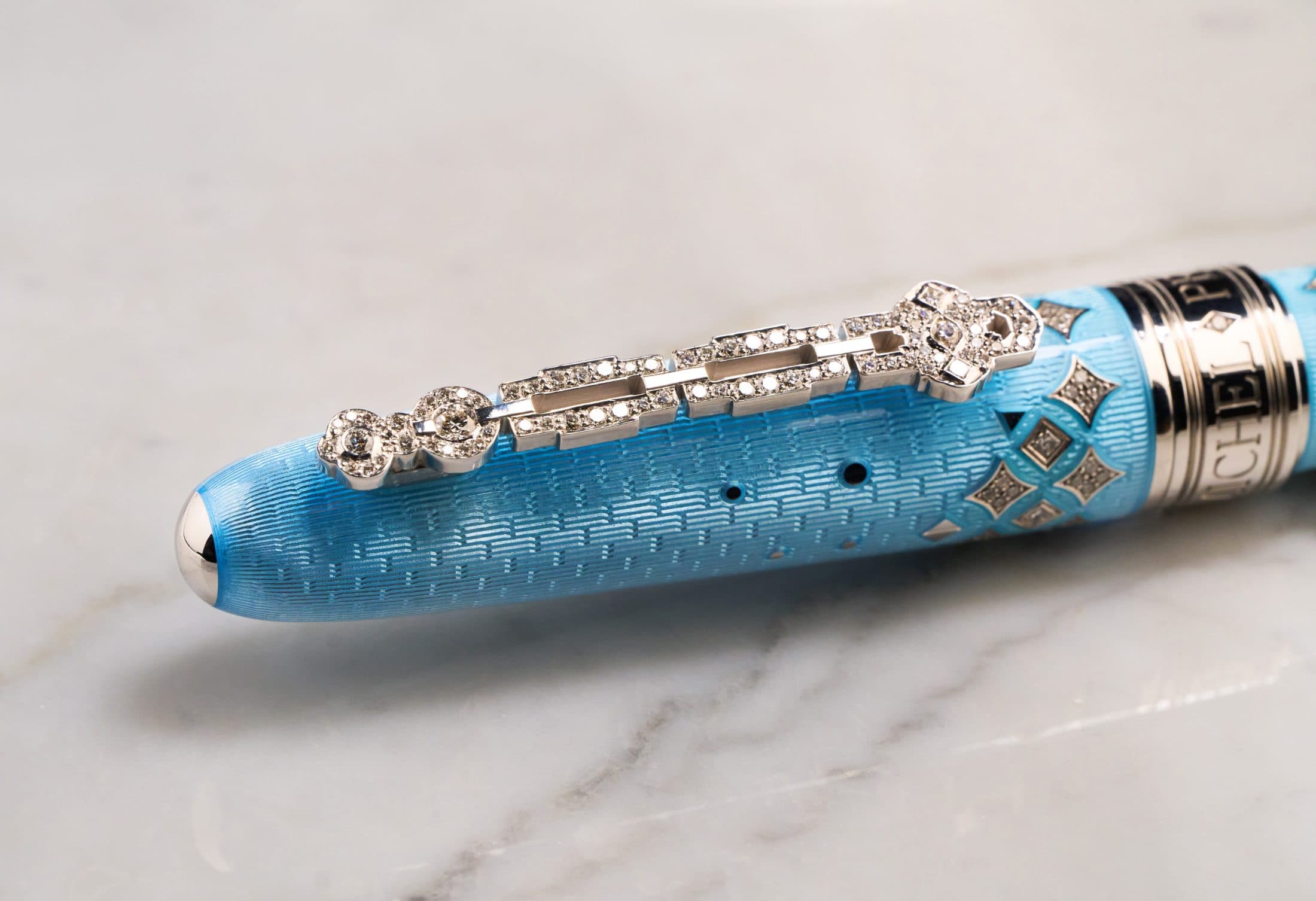 Macro of the diamond-set clip on a Michel Perchin Majesty blue fountain pen