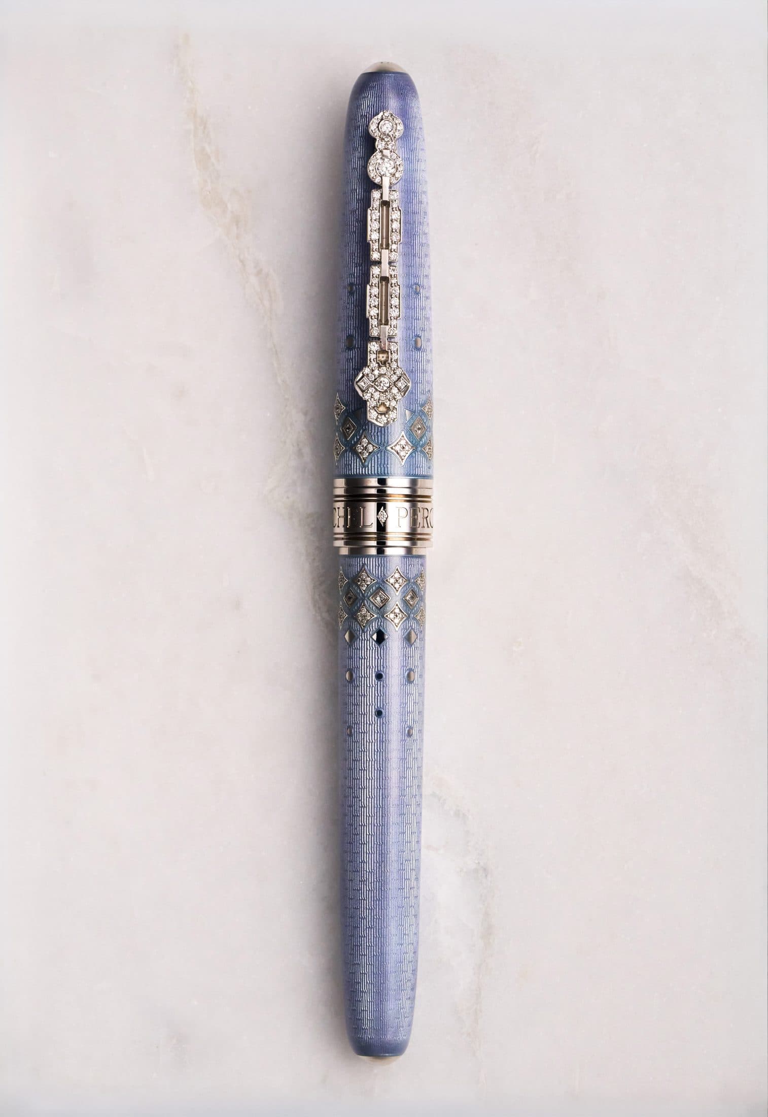 Michel Perchin Majesty periwinkle guilloche enamel fountain pen, full length on Carrara marble