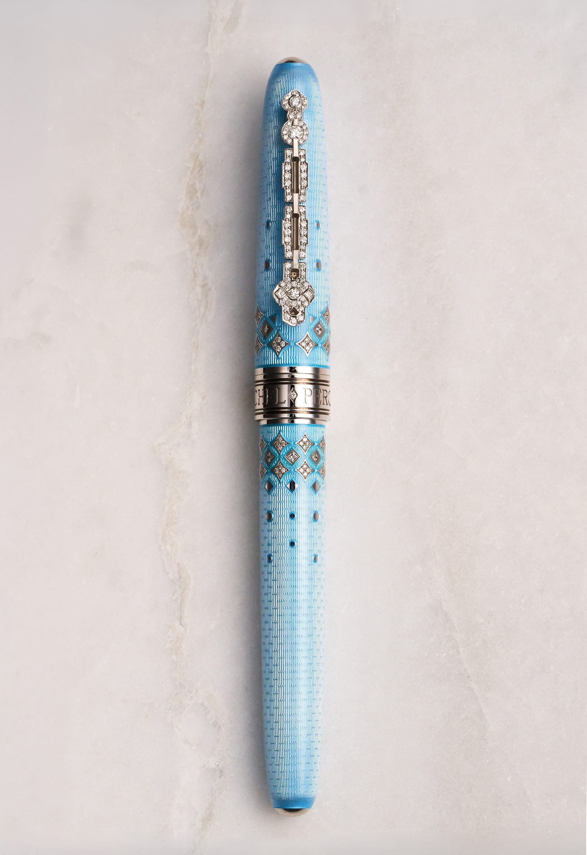 Michel Perchin Majesty blue fired-enamel fountain pen with diamond-set cap, luxury product photography by Henry David Photography in St. Louis
