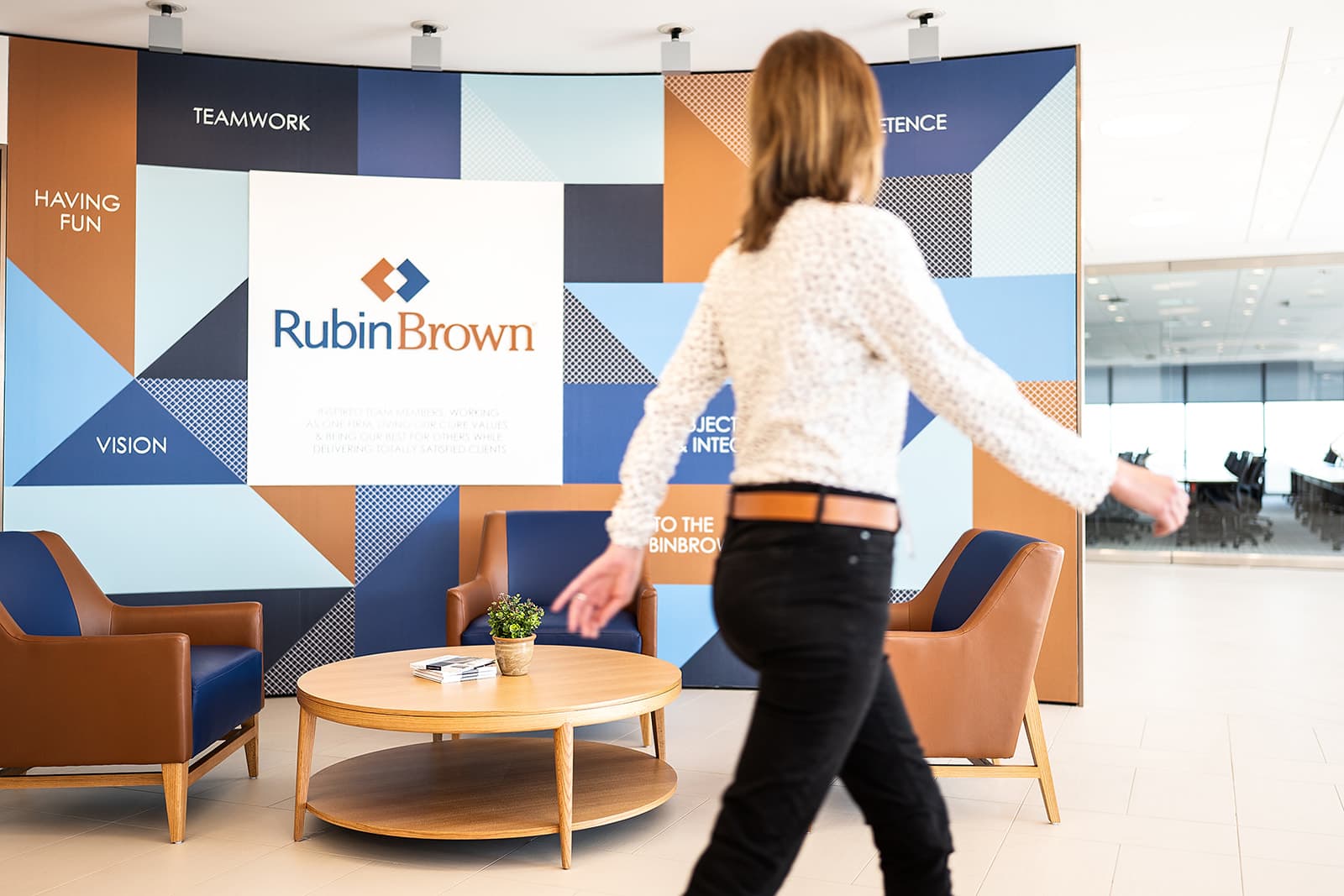 RubinBrown branded culture wall showing authentic corporate lifestyle photography