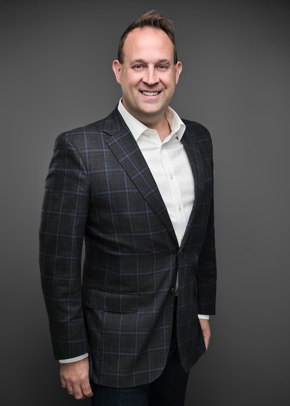 Professional corporate headshot of a RubinBrown team member, photographed on a consistent studio setup by Henry David Photography in St. Louis