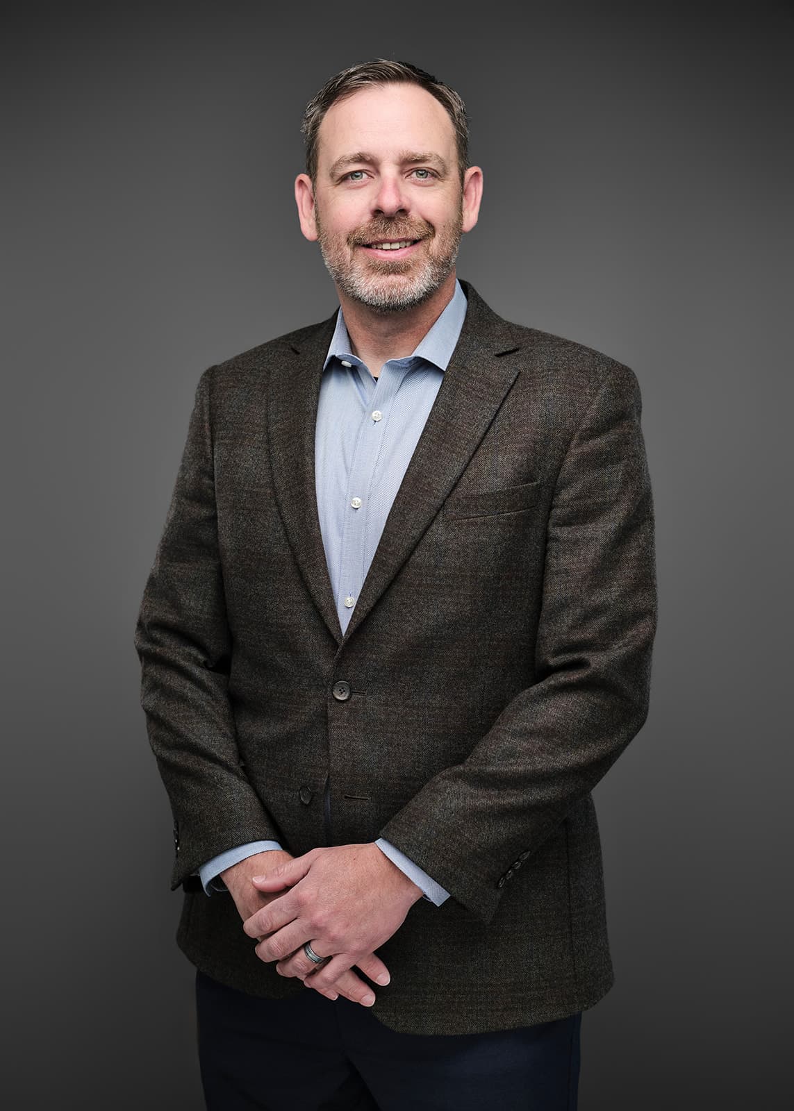 Professional corporate headshot of a RubinBrown team member, photographed on a consistent studio setup by Henry David Photography in St. Louis
