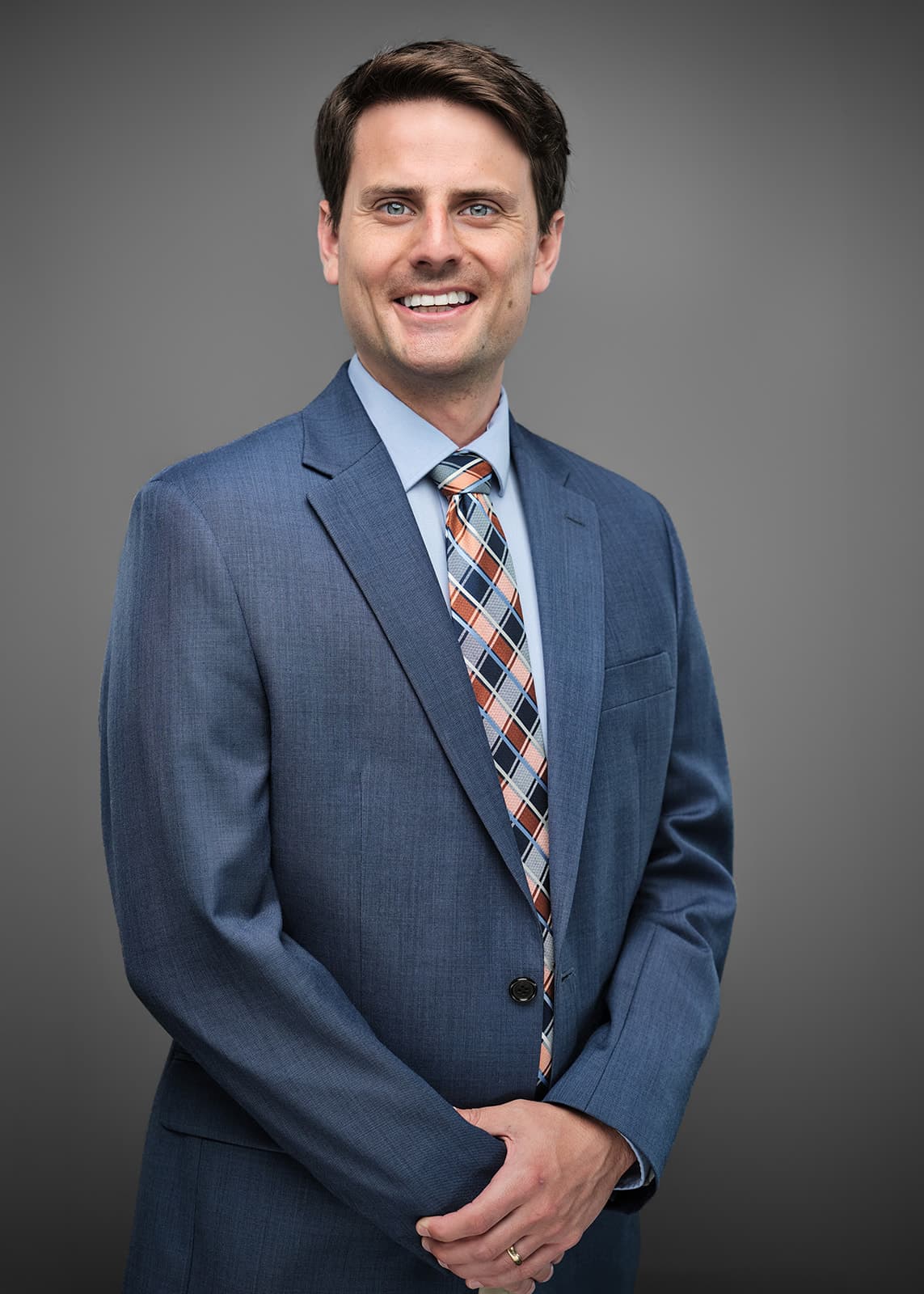 Professional corporate headshot of a RubinBrown team member, photographed on a consistent studio setup by Henry David Photography in St. Louis
