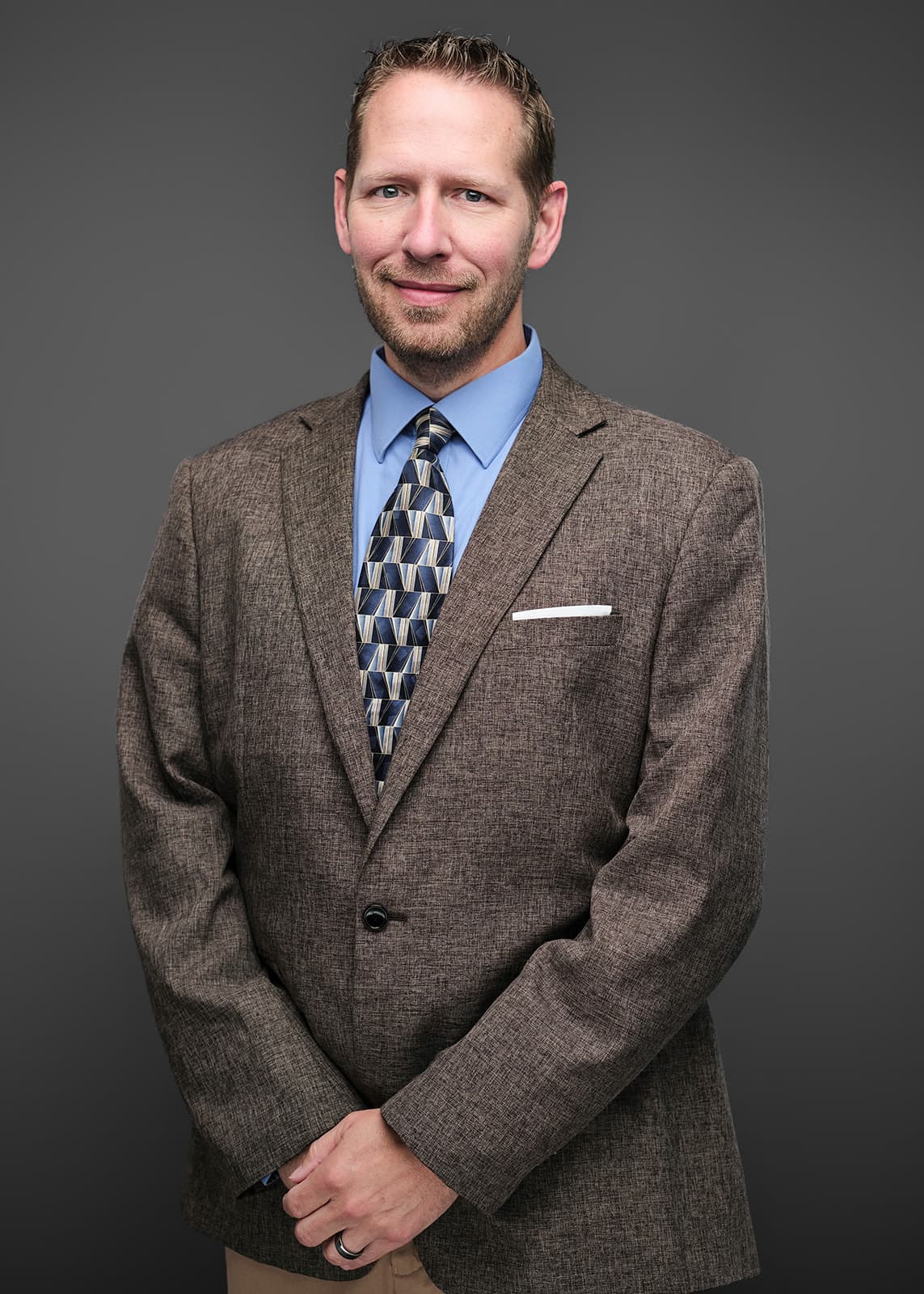 Professional corporate headshot of a RubinBrown team member, photographed on a consistent studio setup by Henry David Photography in St. Louis
