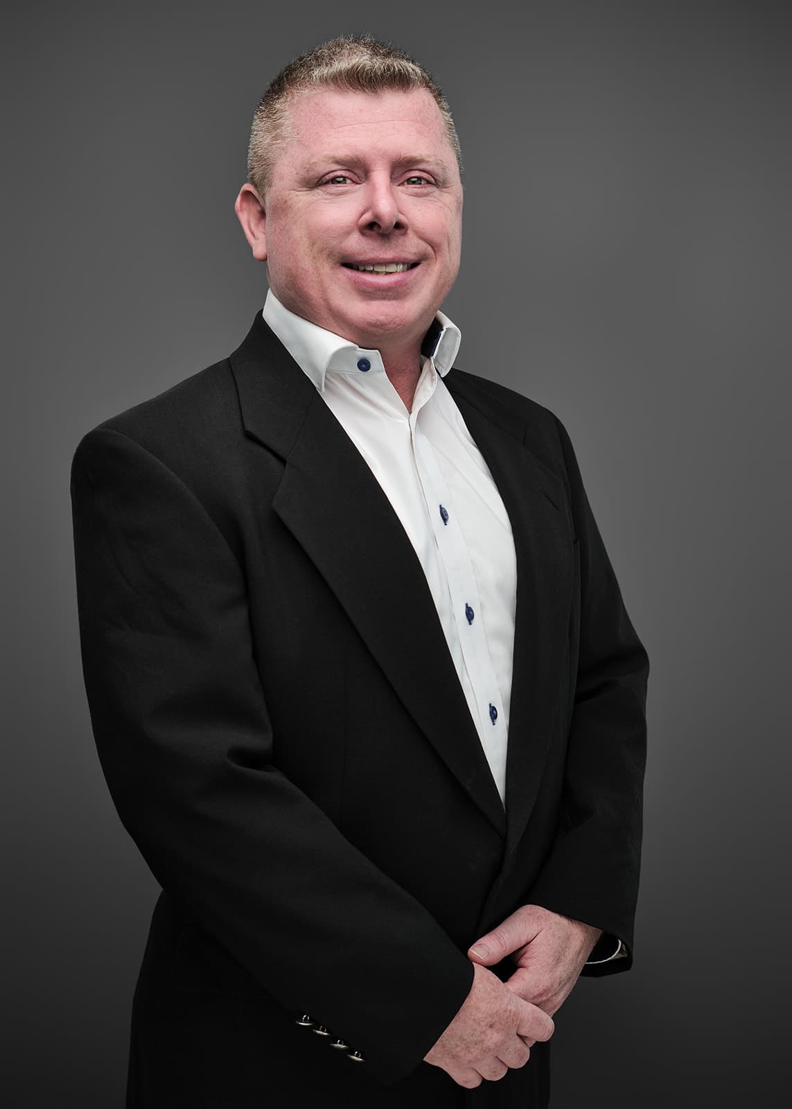 Professional corporate headshot of a RubinBrown team member, photographed on a consistent studio setup by Henry David Photography in St. Louis