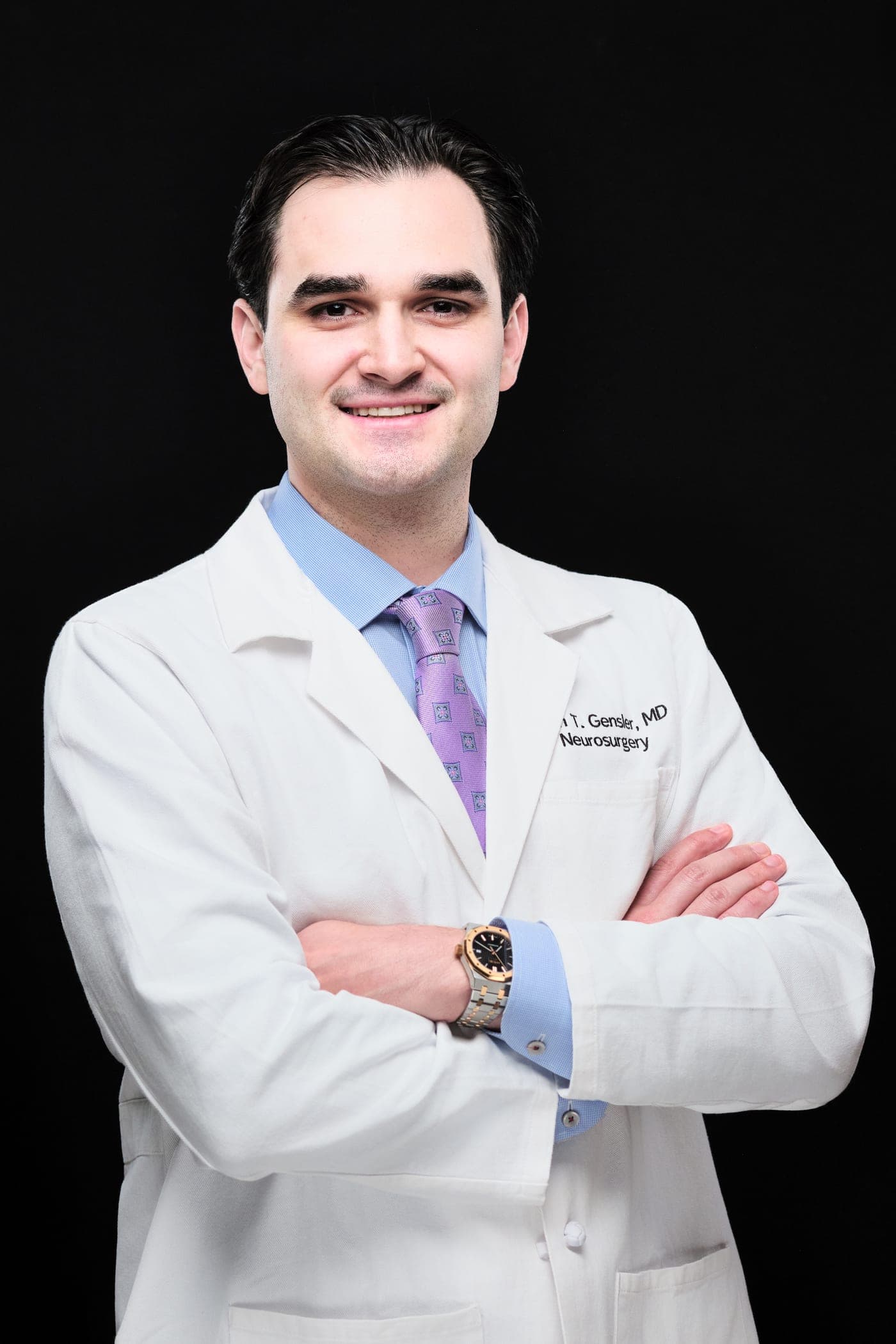Washington University neurosurgery white coat headshot on a black studio background in St. Louis by Henry David Photography